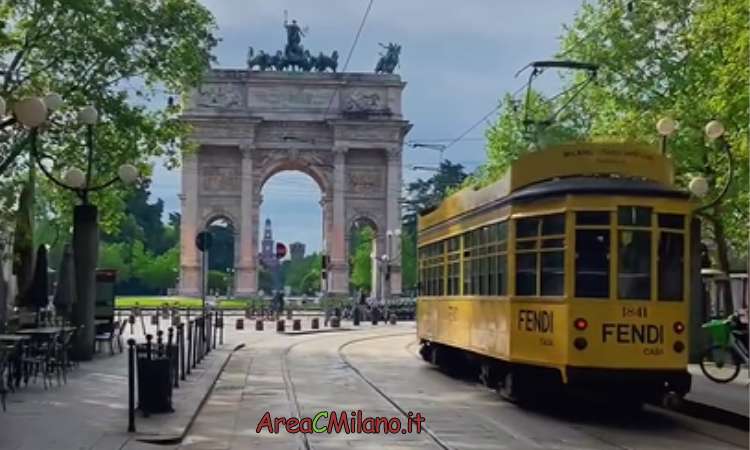 A tram passing by the Arch of Peace